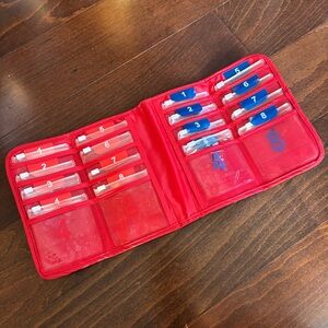 Magellan’s Travel Organizer, Red, with 16 clear slide-lock pouches
